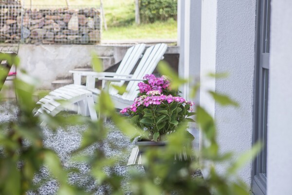 Foto van Zeer verzorgd vakantiehuis met open haard, gelegen nabij een bos - GardenSummer